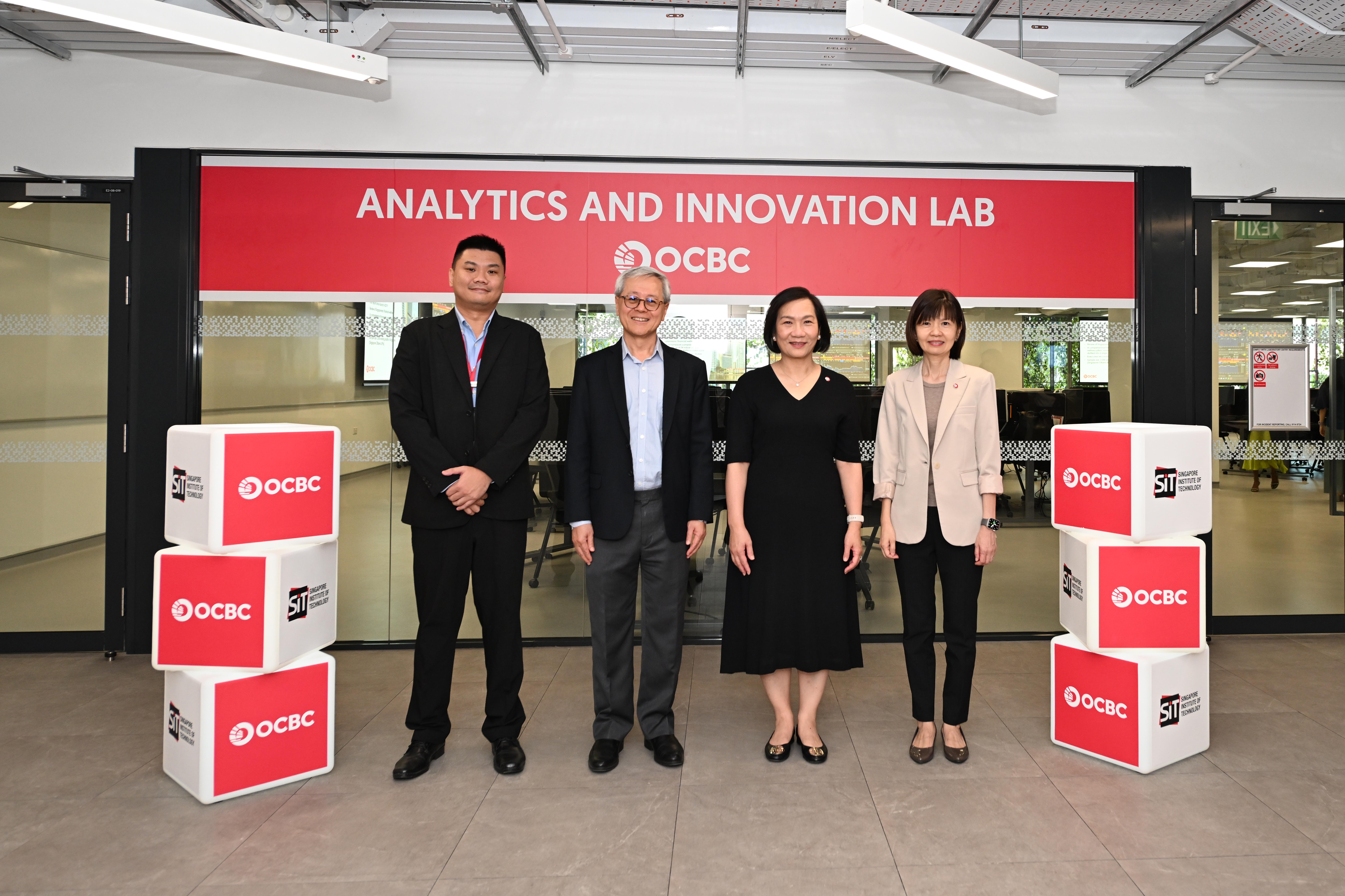 (From left to right) Mr Sunny Soh, Professional Officer, Business Communication and Design Cluster, SIT; Professor Chua Kee Chaing, President, SIT; Ms Helen Wong, Group CEO, OCBC and Ms Lee Hwee Boon, Head of Group Human Resources, OCBC, at the Analytics and Innovation lab in SIT