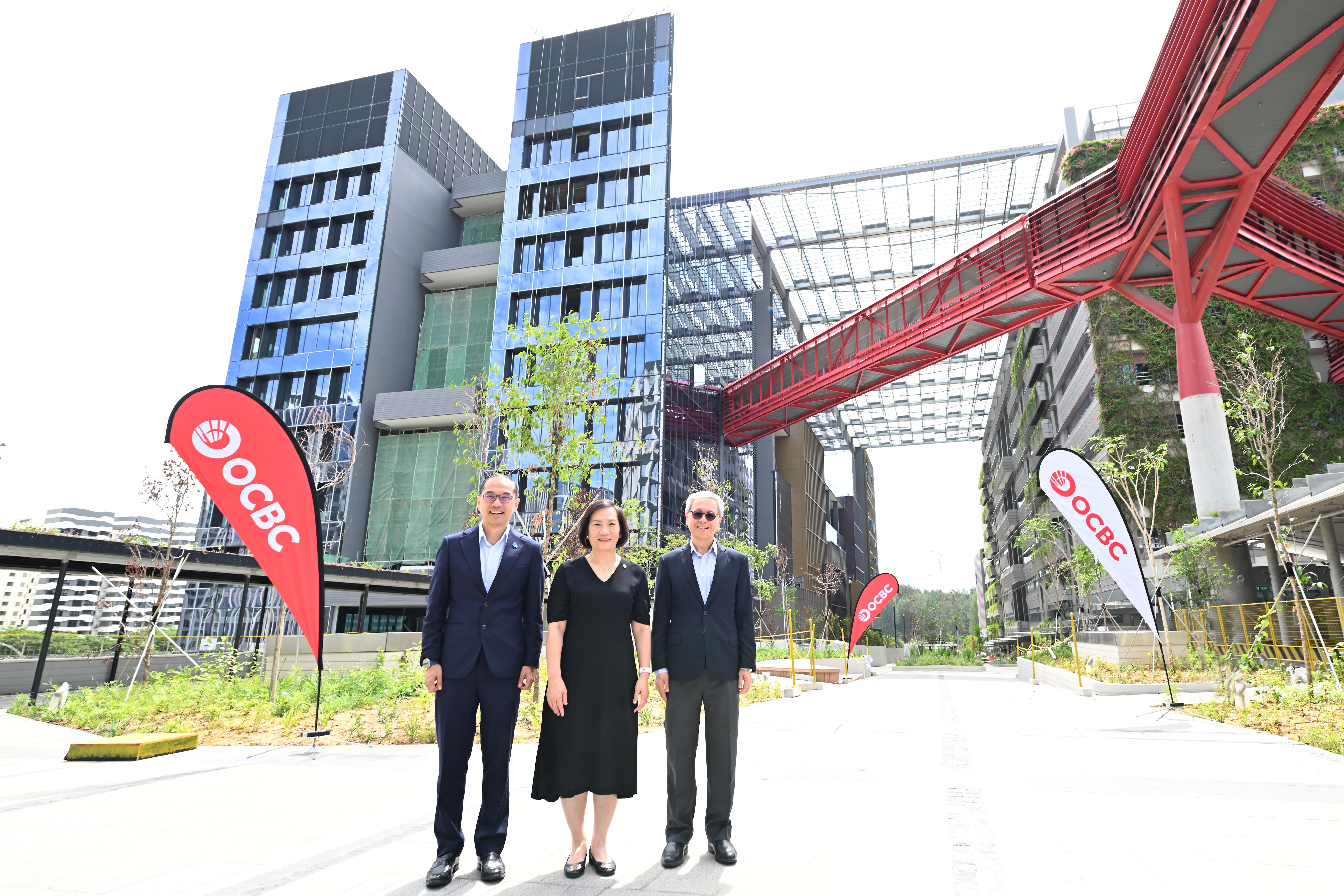 (From left to right) Mr Tan Boon Khai, Chief Executive, JTC; Ms Helen Wong, Group CEO, OCBC and Professor Chua Kee Chaing, President, SIT in front of the OCBC Punggol building at Punggol Digital District