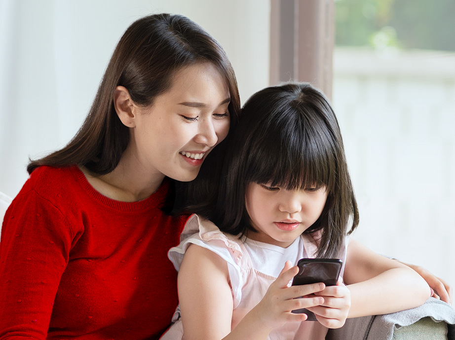 Mother and teen daughter trying out digital payments